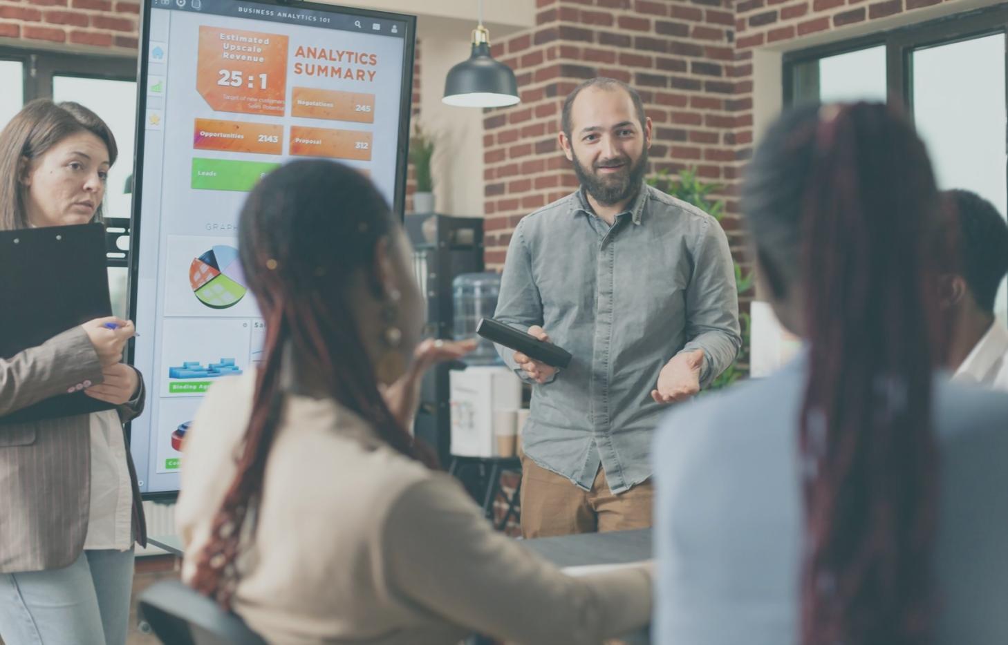 Professional reviewing SEO analytics data on a monitor